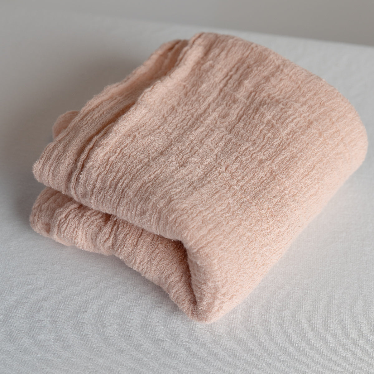 Pink gauze swaddle