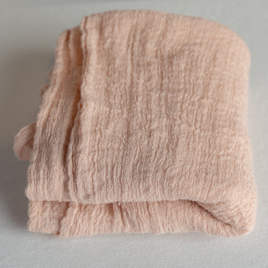 Pink gauze swaddle