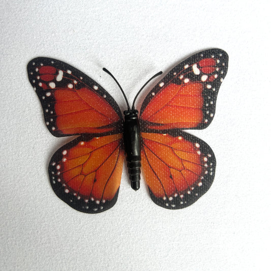 12 butterflies in orange or pink plus fishing line and sticky squares