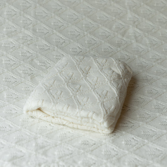 white knit blanket layer or backdrop