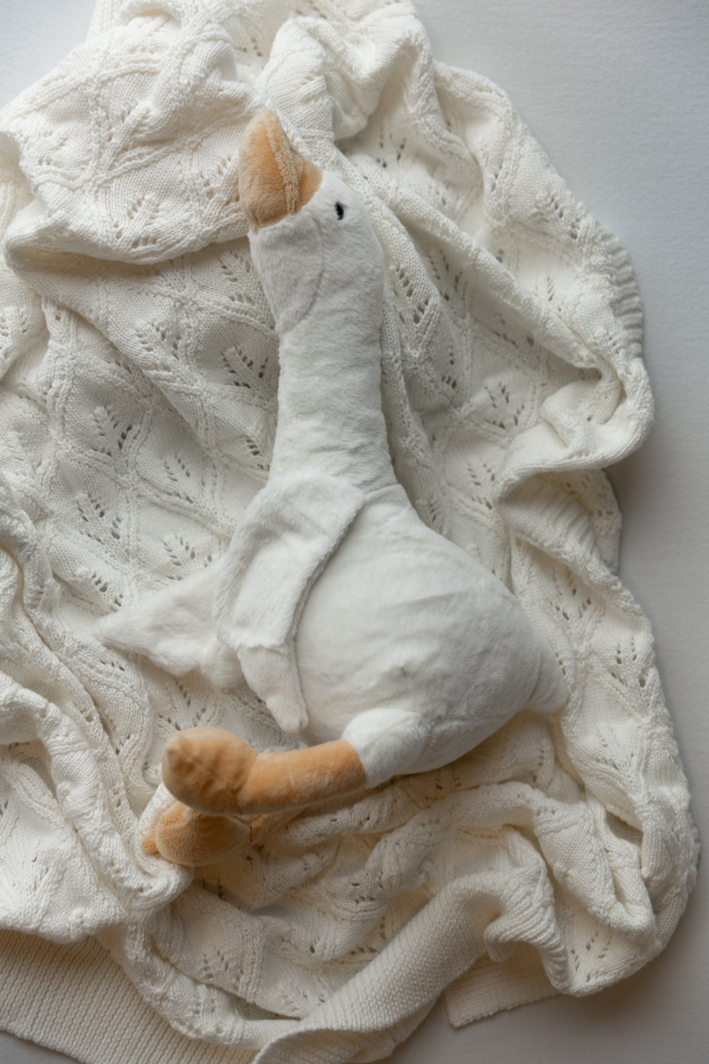 white knit blanket layer or backdrop