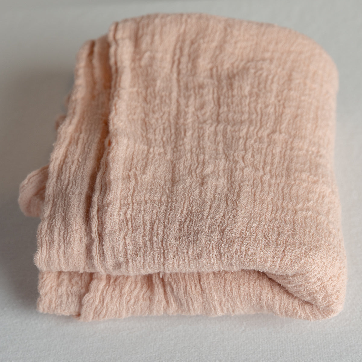Pink gauze swaddle
